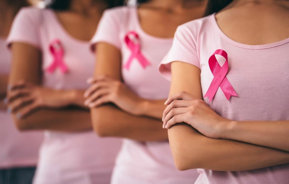 women with breast cancer ribbon - ways to reduce breast cancer risk when brca+