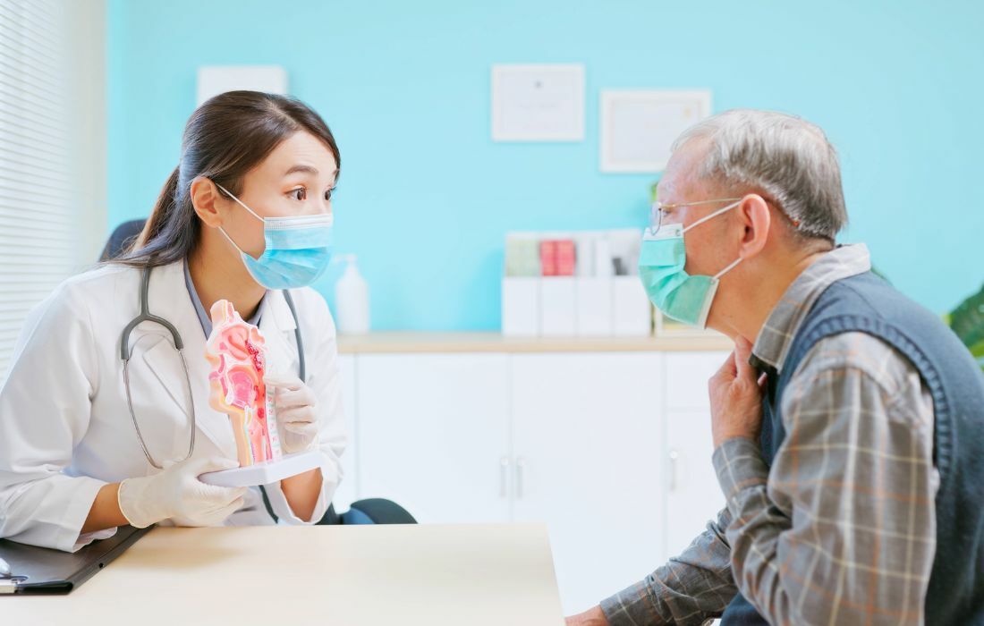 patient with oncologist discussing a head and neck cancer diagnosis, cccb