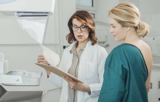 woman consulting breast cancer doctor about treatment plan