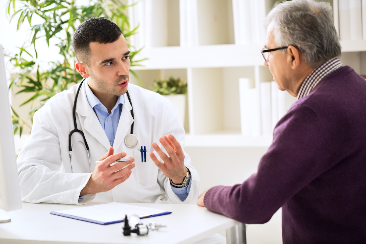 colorectal cancer doctor with patient discussing treatment options