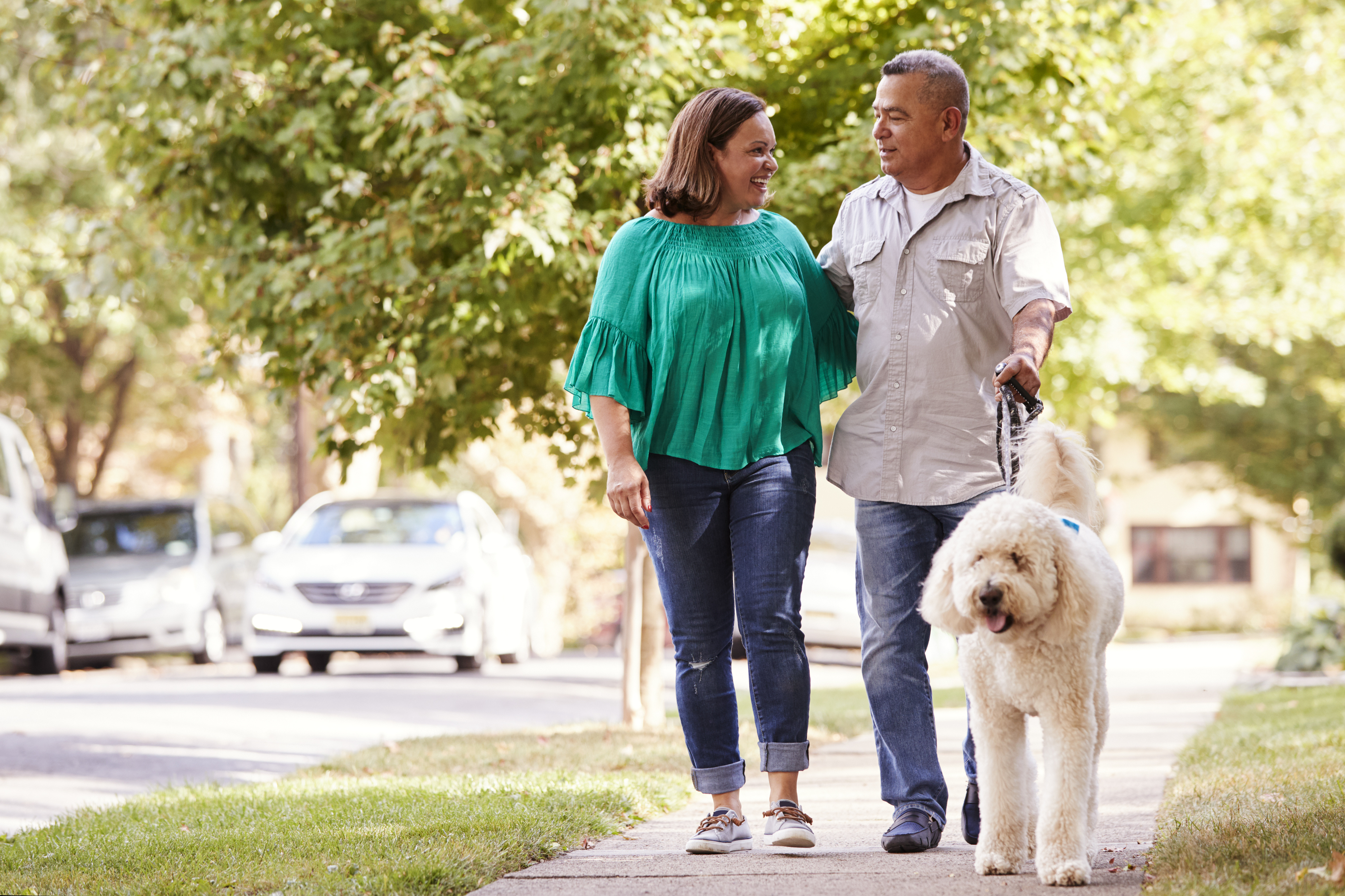 husband and wife walking dog - when to begin screening for colon cancer