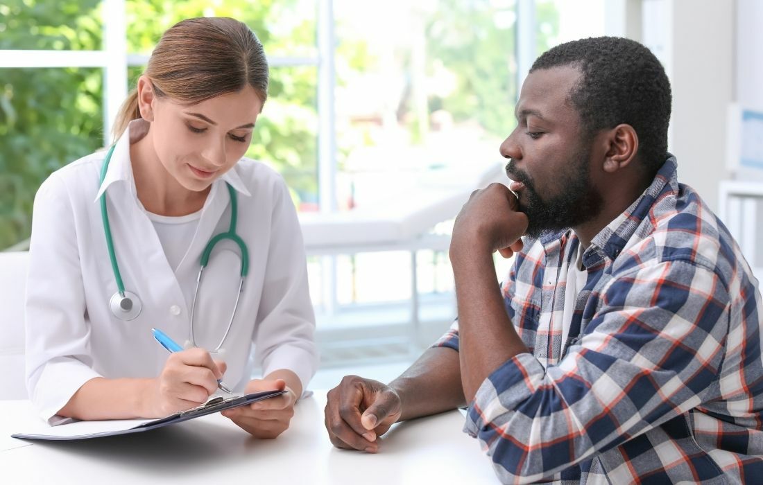 prostate cancer doctor with male patient discussing screening